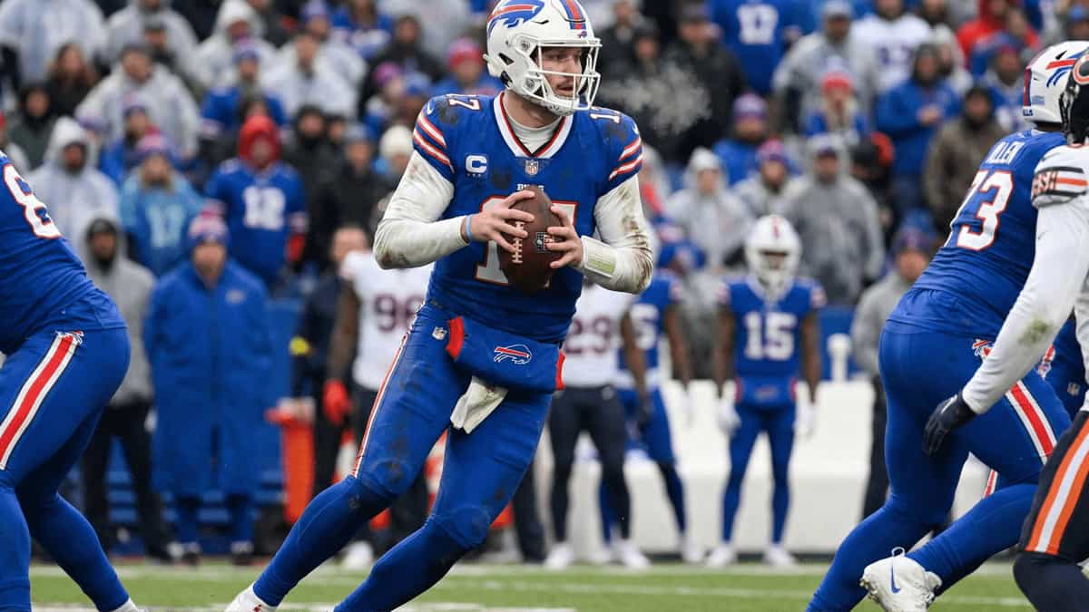 Josh Allen in a Buffalo Bills uniform preparing to throw the football during an NFL game.